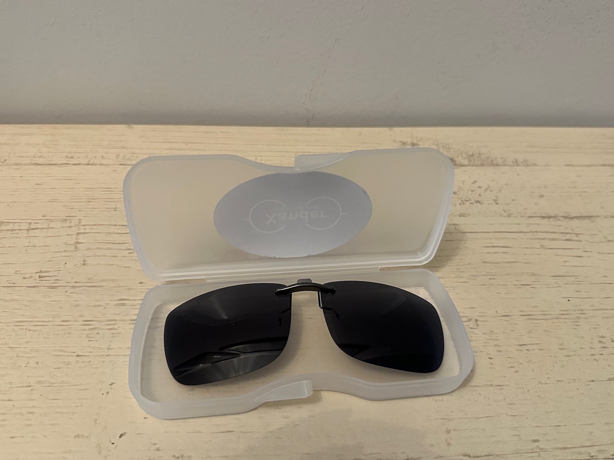 Sunglass clip-on lenses lying on a table